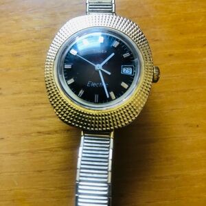 Timex Gold and Black Electric Watch